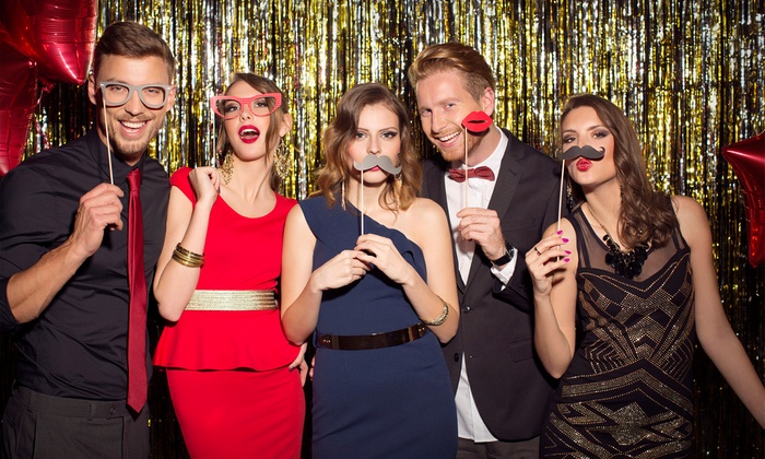 Guests enjoying the photobooth with props